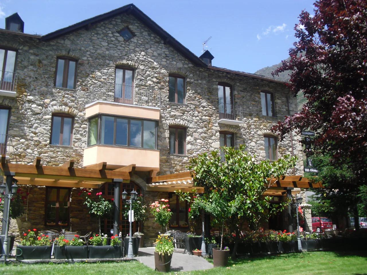 The guesthouse's stone facade with its garden in front